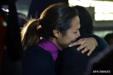 Relatives and supporters of Egyptian activist Alaa Abdel Fattah react after the verdict in his trial at a police institute in Cairo's Tora prison on February 23, 2015. Fattah, a leading dissident in the 2011 uprising tha...