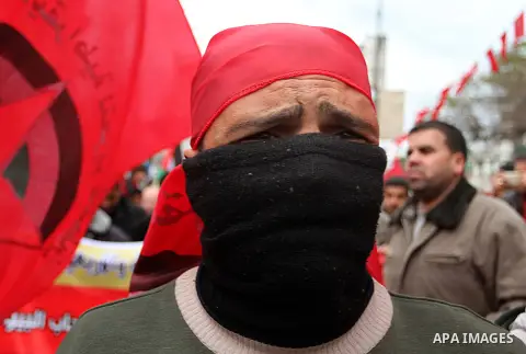 A Palestinian man chants slogans during a rally marking the 46th anniversary of the founding of the Democratic Front for the Liberation of Palestine (DFLP), in Rafah in the southern Gaza Strip February 23, 2015. Photo by...