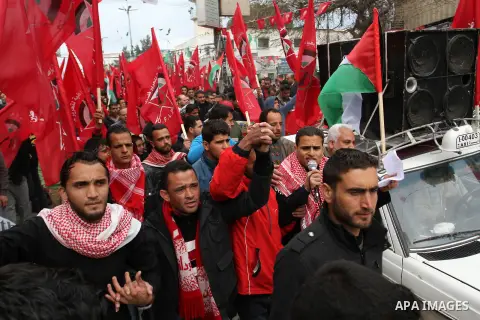 Palestinians chant slogans during a rally marking the 46th anniversary of the founding of the Democratic Front for the Liberation of Palestine (DFLP), in Rafah in the southern Gaza Strip February 23, 2015. Photo by Abed...