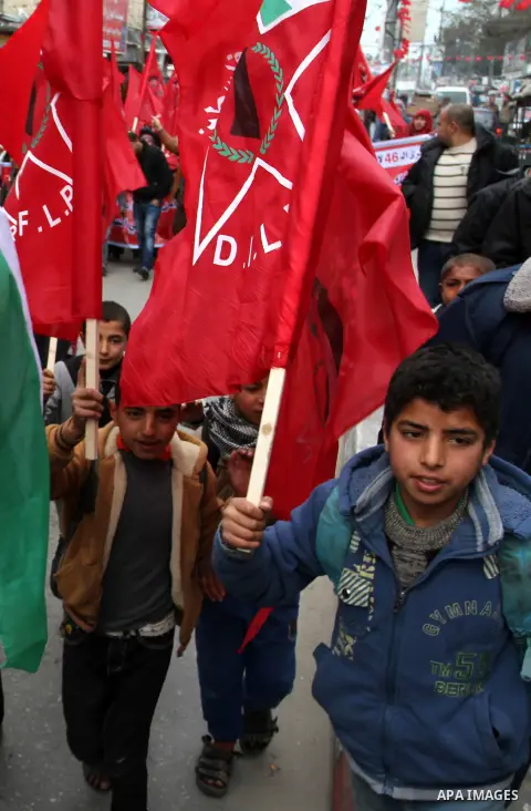 Palestinian children chant slogans during a rally marking the 46th anniversary of the founding of the Democratic Front for the Liberation of Palestine (DFLP), in Rafah in the southern Gaza Strip February 23, 2015. Photo...