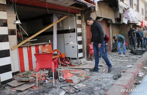 An Egyptian inspects one of the blast sites after the explosion in the Imbaba area in Giza, outskirt of Cairo, Egypt, on Feb. 26, 2015. Six bombs detonated in the greater Cairo area in Egypt early on Thursday morning, ki...