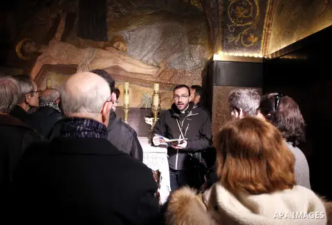 Christian pilgrims pray at the Church of the Holy Sepulchre in Jerusalem's Old city February 26, 2015. A fire damaged a Greek Orthodox seminary in Jerusalem on Thursday and "anti-Christian" graffiti was found at the scen...