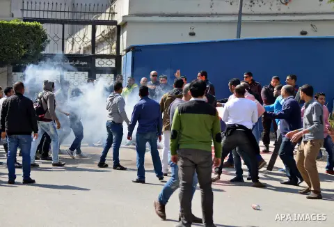 Egyptian students who support ousted President Mohamed Morsi and the Muslim Brotherhood raid a security gate during protest against the military rule, in Cairo University on March 1, 2015. Due to the escalation of studen...