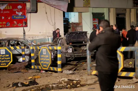 Egyptian security officials inspect the site of an explosion outside the Zahraa El-Maadi police station in Cairo, Egypt, on March 3, 2015. Photo by Amr Sayed