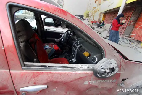 Egyptians inspect the blas site in the district of Al Matariya in eastern Cairo, on March 3, 2015. Five improvised bombs exploded early Tuesday in Cairo's Matariya district in an apparent targeting of Vodafone and Mobini...