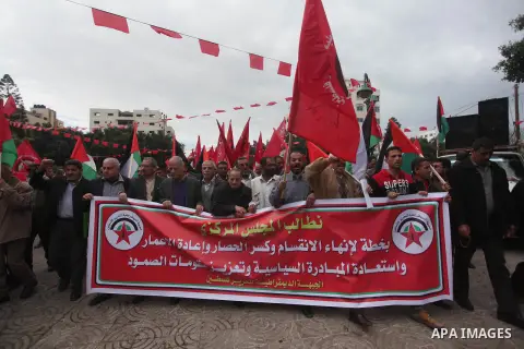 Palestinian supporters of the Popular Front for the Liberation of Palestine (PFLP) take part a protest demanding for reconstruction of houses which were destroyed during the recent Israeli war, in Gaza city, on March 04,...