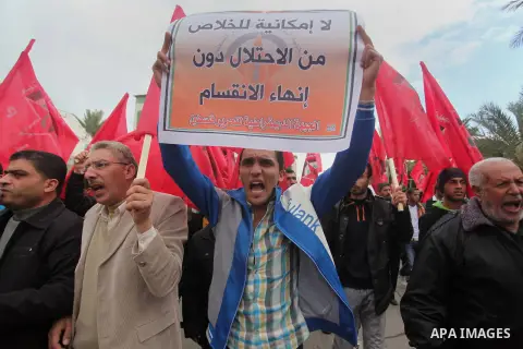 Palestinian supporters of the Popular Front for the Liberation of Palestine (PFLP) take part a protest demanding for reconstruction of houses which were destroyed during the recent Israeli war, in Gaza city, on March 04,...