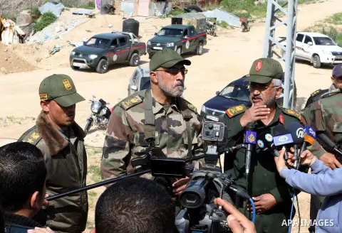 Palestinian National Security Forces commander Hussain Abu Athra, speaks to media as he inspects the border between Egypt and southern Gaza Strip, in Rafah on March 5, 2015. Gaza's border crossings will be reopened once...
