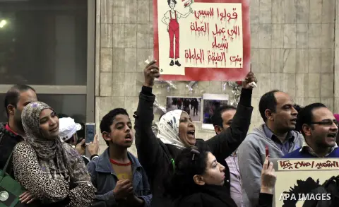 Egyptian demonstrators shout slogans during a demonstration in Cairo on March 05, 2015 protesting the killing of Shaima al-Sabbagh. Al-Sabbagh who was killed in clashes with Egyptian police during a rare leftwing protest...