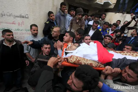 Mourners carry the body of Palestinian fisherman Tawfiq Abu Reyala, 34, whom medics said was killed by Israeli navy, during his funeral at Shatti refugee camp in Gaza City March 7, 2015. The Israeli navy opened fire on b...