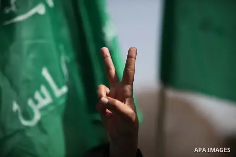 Palestinian women take part in a rally of Hamas supporters in front of the headquarters of the United Nations Relief and Works Agency (UNRWA) on the occasion of International Women's Day in Gaza City on March 8, 2015. Ph...