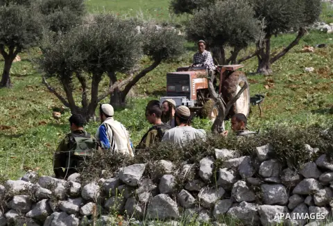 Israeli soldiers break up a fight between Jewish settlers and Palestinians over farming land between the Jewish settlement of Bracha and the nearby West Bank village of Burin, near Nablus on March 09, 2015. Photo by Neda...