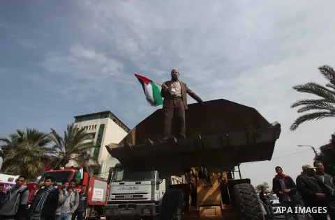 Palestinian employees of former Palestinian government take part a protest demanding their salaries to be paid, in front of the Legislative Council in Gaza city on March 10, 2015. Some 40,000 civil servants employed by t...