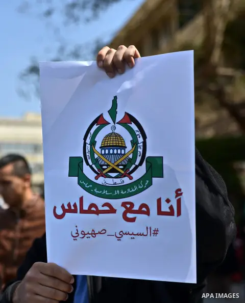 Egyptian students who support Muslim Brotherhood and ousted president Mohammed Morsi hold banners during a demonstration in solidarity with the Islamic Palestinian movement of Hamas, at Cairo University on March 15, 2015...