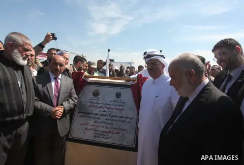 Qatar's Ambassador to the Palestinian Authority, Mohammed Al Emadi attends the ceremony of the unveiling of the foundation stone of the Sheikh Hamad Town for the Palestinian released prisoners, in the central Gaza Strip,...