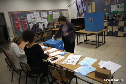 An Israeli woman casts her ballot at a polling station in the northern city of Haifa March 17, 2015. Millions of Israelis voted on Tuesday in a tightly fought election, with Prime Minister Benjamin Netanyahu facing an up...