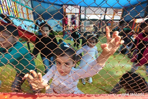 Palestinian children enjoy at an amusement park to mark the anniversary of Mother's Day, in Gaza City March 21, 2015. Photo by Ashraf Amra