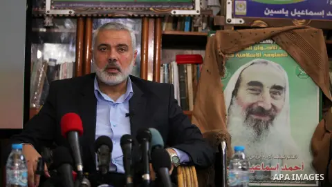 Senior leader of Hamas Ismail Haniyeh speaks during his visit to the home of the late Hamas spiritual leader Sheikh Ahmed Yassin, marking the 11th anniversary of his death in Gaza City, March 22, 2015. Photo by Ashraf Am...