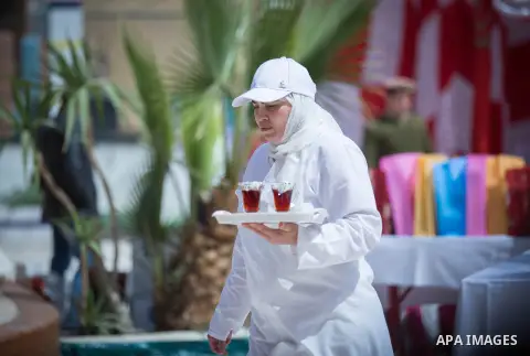 Egyptian women prisoners celebrate to mark the anniversary of Mother's Day, at El-Qanater jail, cairo, on March 23, 2015. Photo by Stringer