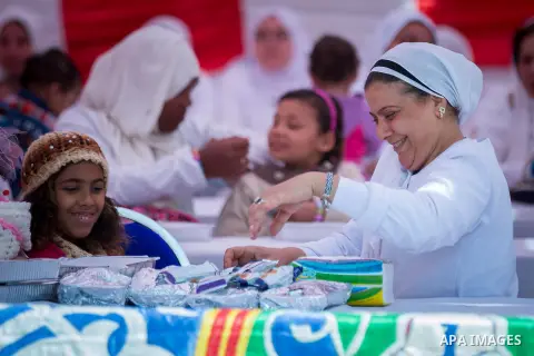 Egyptian women prisoners celebrate to mark the anniversary of Mother's Day, at El-Qanater jail, cairo, on March 23, 2015. Photo by Stringer