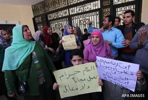 Egyptians Teachers hold banners during a protest demanding their rights, in Cairo, on March 24, 2015. Photo by Amr Sayed