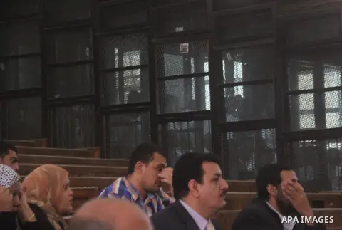 Egyptian relatives attend a trial of Muslim Brotherhood members in a case known in media as "Rabaa Operation Room", in Cairo on March 25, 2015. The prosecution accused the defendants of several charges relating to prepar...