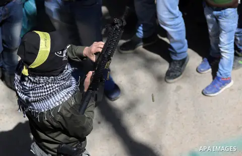 Relatives of Ali Mahmoud Safi, a 20-year-old, from Jalazoun refugee camp, mourn during his funeral in the West Bank near Ramallah, March 26, 2015. Safi died on Wednesday from injuries sustained last week during clashes w...