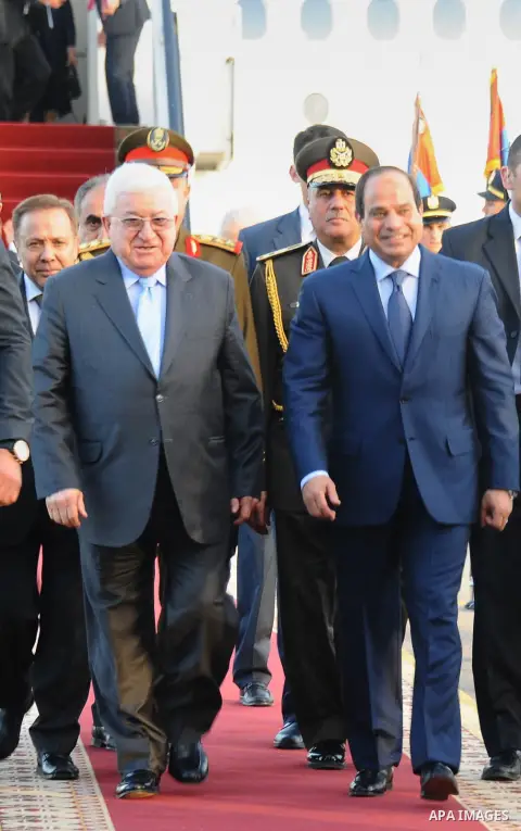 A handout picture made available by the Egyptian presidency shows Egyptian President Abdel Fattah al-Sisi (L) welcoming Iraqi President Fuad Masum upon the latter's arrival in Red Sea resort of Sharm El-Sheikh on March 2...