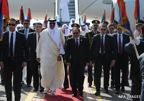 Egypt's President Abdel Fattah al-Sisi (L) receives Qatar Sheikh Tamim bin Hamad al Thani upon his arrival ahead of the Arab Summit in Sharm el-Sheikh, in the South Sinai governorate, south of Cairo, March 28, 2015. Arab...