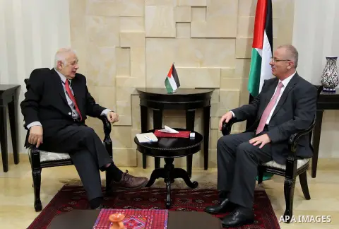 Palestinian prime minister Rami Hamdallah meet with Palestinian Central Elections Commission chief, Hanna Nasser, in the West bank city of Ramallah, on march 29, 2015. Photo by Prime Minister Office