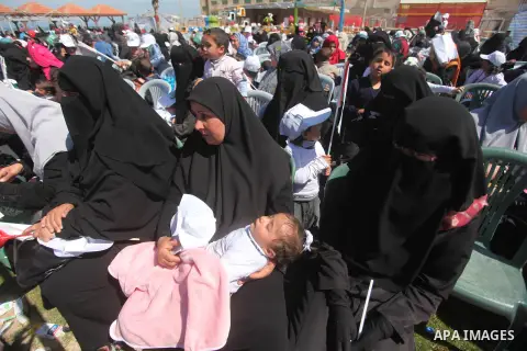 Palestinian orphans attend a ceremony to mark the Orphan Day, in Gaza city, on April 2, 2015. Photo by Ashraf Amra