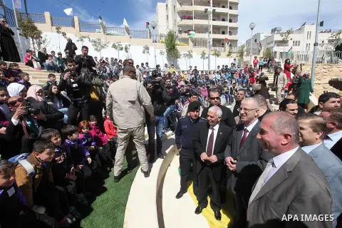 A picture released by the Palestinian Prime Minister office shows Palestinian Prime Minister Rami Hamdallah participating in the opening ceremony of al-Salam park in the West Bank city of Hebron, April 2, 2015. PMO