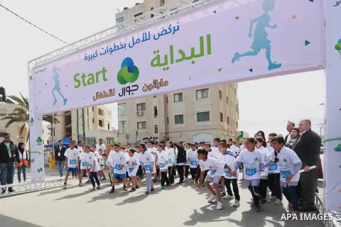 Palestinian boys take part in a marathon to mark the Palestinian Child Day, organized by Jawwal in the West Bank city of Ramallah, on April 4, 2015. Photo by Shadi Hatem