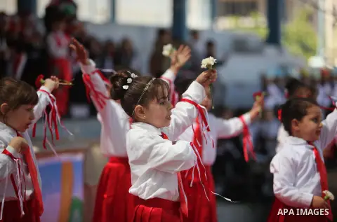 Palestinian children take part in a celebration to mark the Children's Day, at University College of Applied Sciences in Gaza city on April 5, 2015. Photo by Ashraf Amra