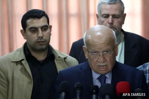 Member of the Executive Committee of the Palestine Liberation Organization for Fateh, Zakaria al-Agha, speaks during a press conference, in Gaza city, on April 7, 2015. Photo by Mohammed Asad