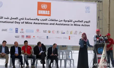 UN humanitarian coordinator James Rawley, and Palestinian Arab Idol Mohammed Assaf attend an event organized by United Nations at a U.N-run training center in Khan Younis in the southern Gaza Strip April 8, 2015. The eve...