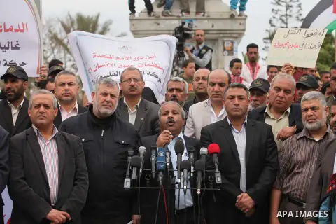 Palestinian factions take part a protest to show solidarity with the Palestinians living in Syria's Yarmouk camp, which is besieged by government forces and has been largely overrun by jihadist fighters, in Gaza city on...