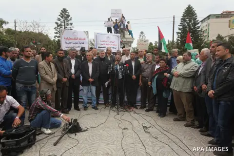 Palestinian factions take part a protest to show solidarity with the Palestinians living in Syria's Yarmouk camp, which is besieged by government forces and has been largely overrun by jihadist fighters, in Gaza city on...