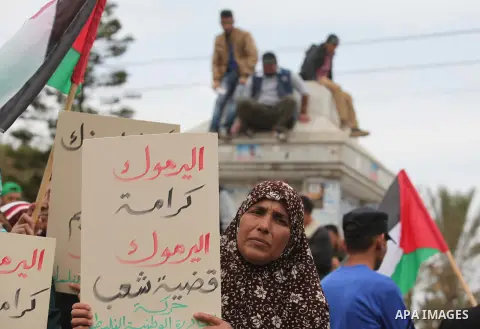 Palestinian factions take part a protest to show solidarity with the Palestinians living in Syria's Yarmouk camp, which is besieged by government forces and has been largely overrun by jihadist fighters, in Gaza city on...