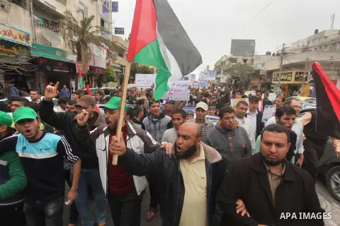 Palestinian factions take part a protest to show solidarity with the Palestinians living in Syria's Yarmouk camp, which is besieged by government forces and has been largely overrun by jihadist fighters, in Gaza city on...