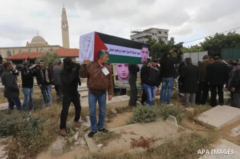 Palestinians take part in a symbolic funeral for the former Palestinian prisoner Jaafar Awad, who was recently released from Israeli jail, in Gaza city on April 11, 2015. Israeli troops shot dead Ziad Awad, the cousin on...