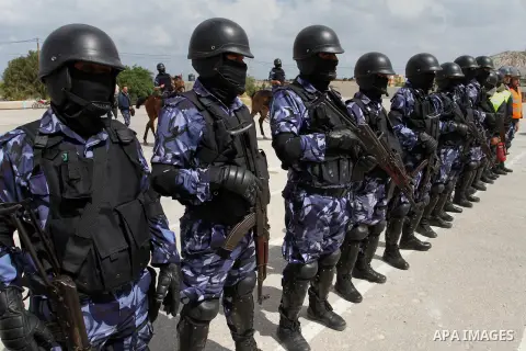 Palestinian policemen demonstrate their skills during a graduation ceremony for special security forces, in Khan Younis in the southern Gaza strip on April 11, 2015. Photo by Abed Rahim Khatib