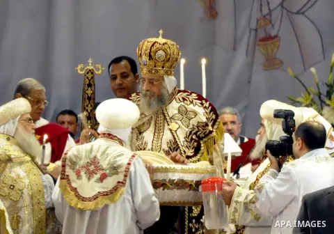 Coptic Pope Tawadros II, head of the Coptic Orthodox church, takes part in a ritual as part of a Coptic Orthodox Easter mass at the main cathedral in Cairo April 11, 2015. Photo by Amr Sayed