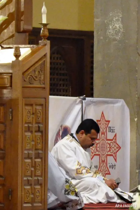 Egyptian Coptic Christians attend the Orthodox Easter mass led by Coptic Pope Tawadros II, head of the Coptic Orthodox church at the main cathedral in Cairo April 11, 2015. Photo by Amr Sayed