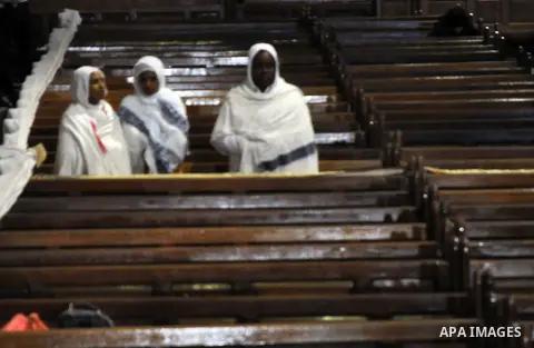 Members of the Ethiopian and Eritrean Orthodox churches attend Easter mass led by Coptic Pope Tawadros II, head of the Coptic Orthodox church at the main cathedral in Cairo April 11, 2015. Photo by Amr Sayed