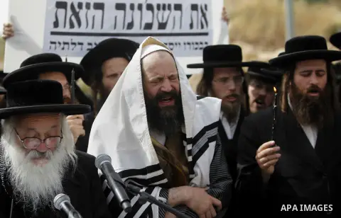 Ultra-Orthodox Jewish men take part in a protest in the town of Beit Shemesh, near Jerusalem April 16, 2015. Dozens of ultra-Orthodox Jewish protesters on Thursday demonstrated against construction at a site they believe...