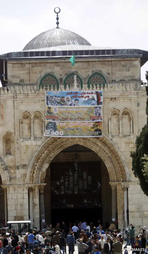 Palestinian Muslim worshipers walk in front of al-Aqsa mosque following Friday prayer, in Jerusalem's old city, on April 17, 2015. Photo by Saeb Awad