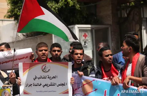 Protesters take part in a protest marking Palestinian Prisoners' Day in front of Red cross office in Gaza City April 19, 2015. Palestinian human rights groups say 6,000 Palestinian prisoners remain in Israeli prisons and...