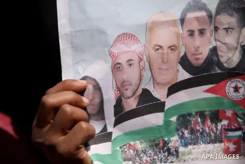 Protesters take part in a protest marking Palestinian Prisoners' Day in front of Red cross office in Gaza City April 19, 2015. Palestinian human rights groups say 6,000 Palestinian prisoners remain in Israeli prisons and...