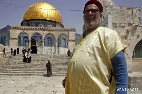 Palestinian worshipers walk in front of the Dome of the Rock mosque, at al-Aqsa mosque compound, in Jerusalem's old city on April 20, 2015. Photo by Saeb Awad